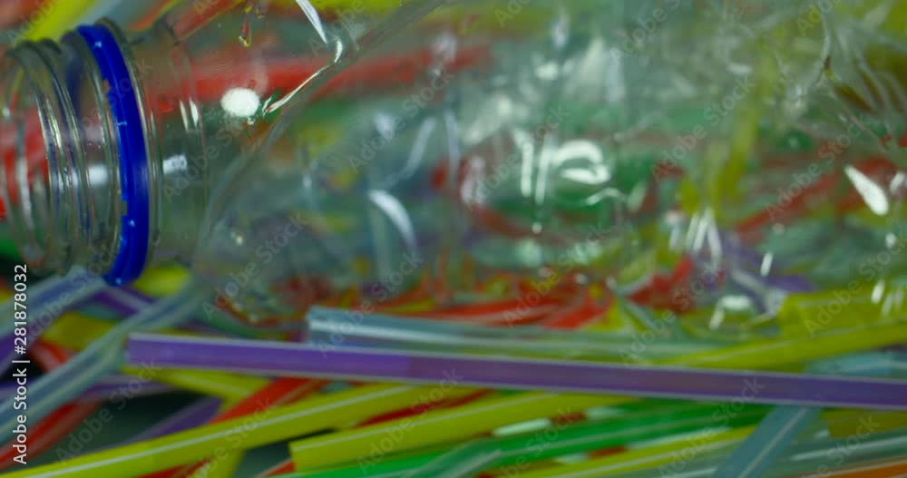 Slow Motion Close Up Panoramic View Of Plastic Bottles With Straws Polluting Ocean With Environmental Issues Slow Motion Close Up Panoramic View Of Plastic Bottles With Straws Polluting Ocean With Environmental Issues