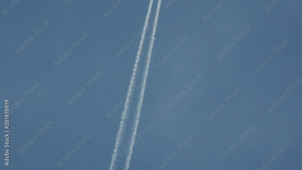 Single Jet Plane Flying in the Blue Sky, Leaving a White Trail. Single Jet Plane Flying in the Blue Sky, Leaving a White Trail.