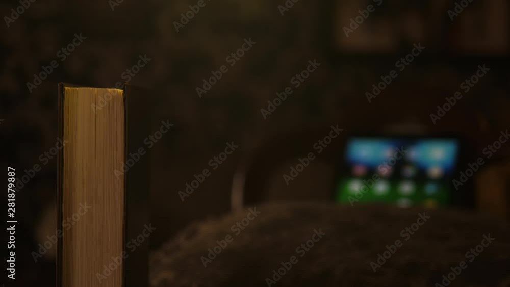 Old Books and tablet Defocused in the Background Old Books and tablet Defocused in the Background