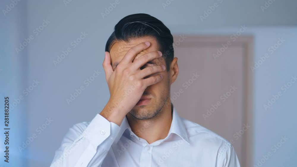 Portrait of shocked man doing facepalm. Unpleasantly surprised businessman. Concept of disappointment, shame and embarrassment. Portrait of shocked man doing facepalm. Unpleasantly surprised businessman. Concept of disappointment, shame and embarrassment.