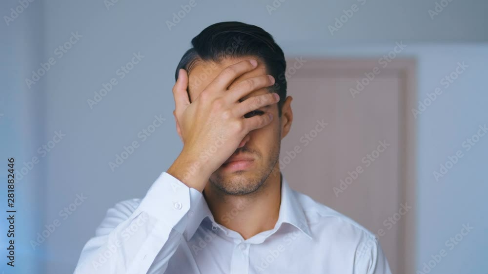 Portrait of shocked man doing facepalm. Unpleasantly surprised businessman. Concept of disappointment, shame and embarrassment. Portrait of shocked man doing facepalm. Unpleasantly surprised businessman. Concept of disappointment, shame and embarrassment.