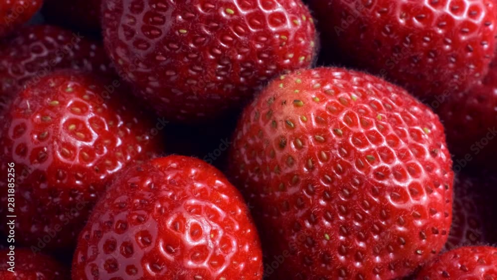 Top view - Rotation of juicy strawberries. Rotation 360 degrees, Extreme close up. 4K - 50fps Top view - Rotation of juicy strawberries. Rotation 360 degrees, Extreme close up. 4K - 50fps