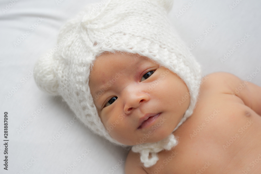 Close up of Asian newborn baby on white background