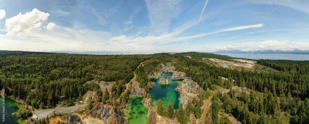 Beautiful Panoramic Aerial View of the Colorful Lakes in the Canadian Nature during a sunny summer day. Taken in British Columbia, Canada.