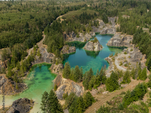 Beautiful Aerial View of the Colorful Lakes in the Canadian Nature during a sunny summer day. Taken in British Columbia, Canada.