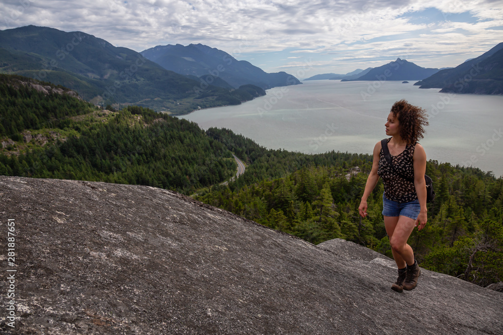 Adventurous Girl Hiking up a mountain during a vibrant summer day. Taken in Murrin Park near Squamish, North of Vancouver, BC, Canada.