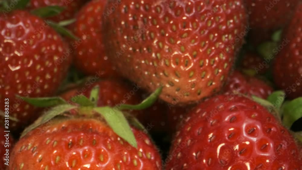 Extreme close up of ripe strawberries. Rotation 360 degrees. 4K - 50fps Extreme close up of ripe strawberries. Rotation 360 degrees. 4K - 50fps