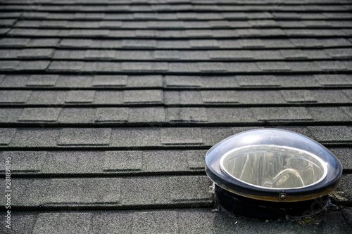 Bilde på lerret Dome shaped solar tube skylight on asphalt shingle roof