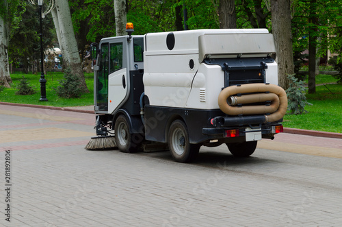 Wallpaper Mural City sweeper in a city square cleans garbage Torontodigital.ca