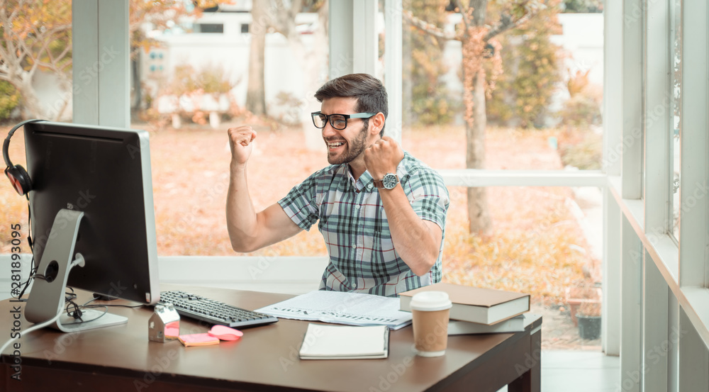 Fototapeta premium work from home concept. Young modern businessman relaxing with notebook while sitting in the office. The successful business analysis, creative design to analyze the management of the investment. 