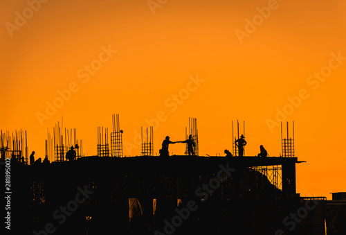 Bild auf Leinwand Construction site with people,silhouette style and far shoot.