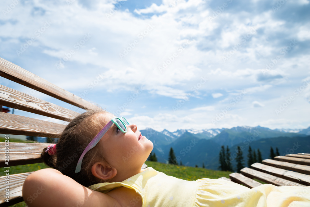 Little Girl Relaxing In Sun Lounger Little Girl Relaxing In Sun Lounger