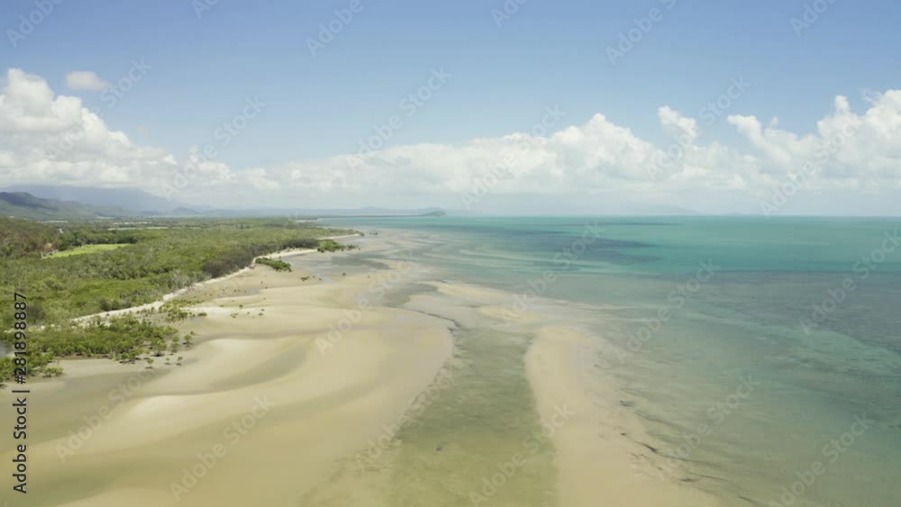 Aerial, low tide and huge sand ocean bed and mangroves growing in Queensland Australia Aerial, low tide and huge sand ocean bed and mangroves growing in Queensland Australia
