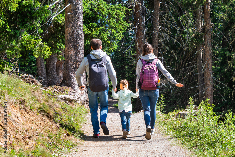 Family Running In Forest Family Running In Forest
