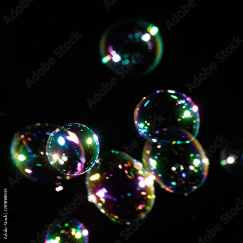 Squared background with transparent colorful soap bubbles © savelov