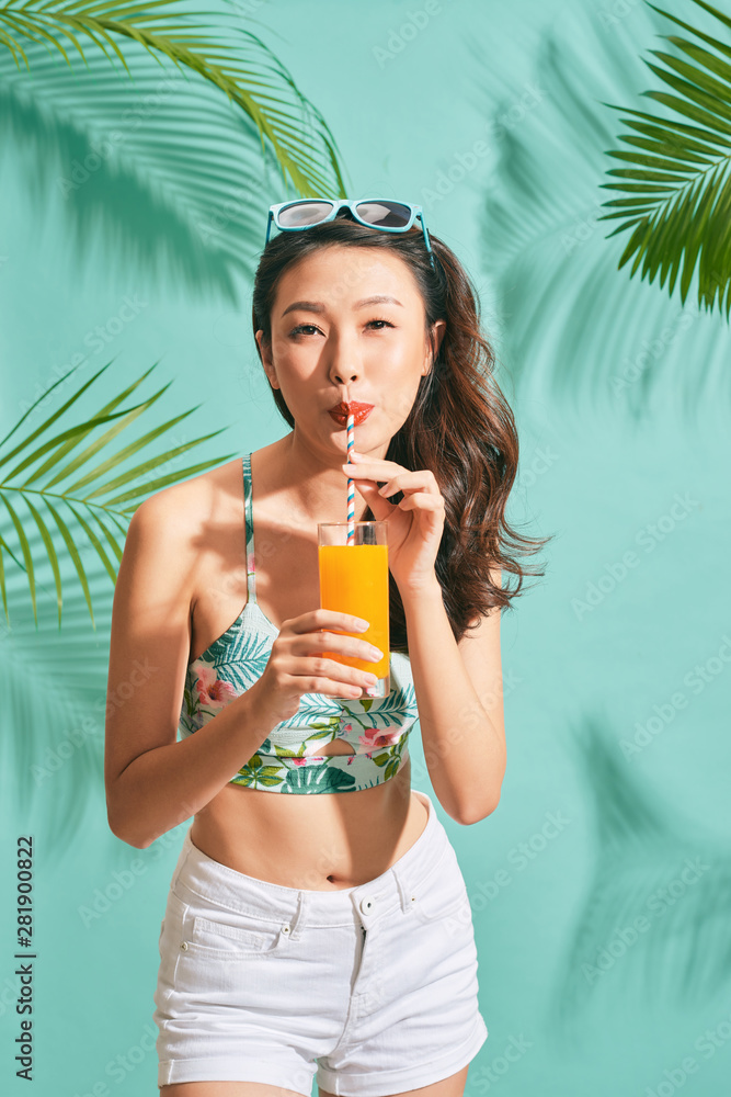 Young sexy asian woman in mini denim shorts drinking tasty juice on summer  time Stock Photo | Adobe Stock