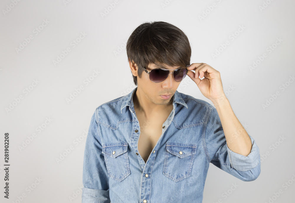 Portrait Man in Jeans Shirt Fashion Touching Eyeglasses Portrait Man in Jeans Shirt Fashion Touching Eyeglasses
