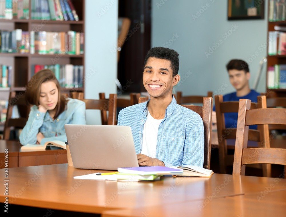 Group of students studying at table in library Group of students studying at table in library