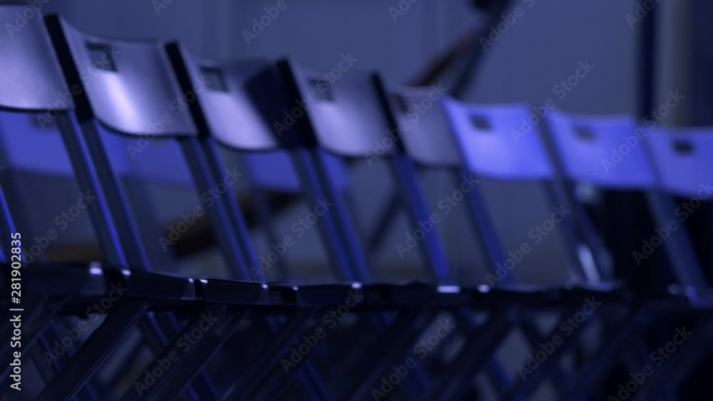 Rows of empty plastic chairs ready for business conference audience. Rows of empty plastic chairs ready for business conference audience.