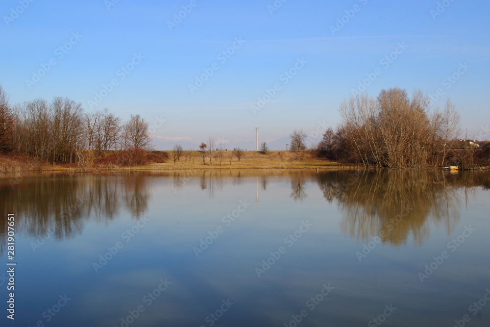 Small lake in the countryside and winter colors