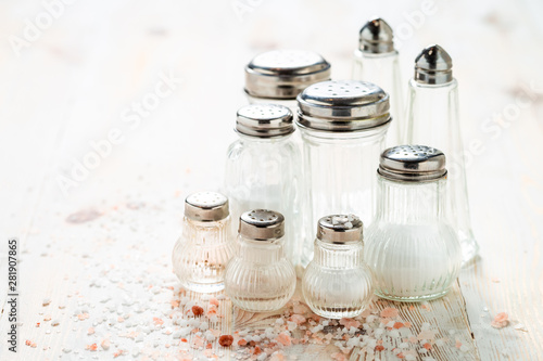 Closeup of Iodized salt in salt cellar on white table photo