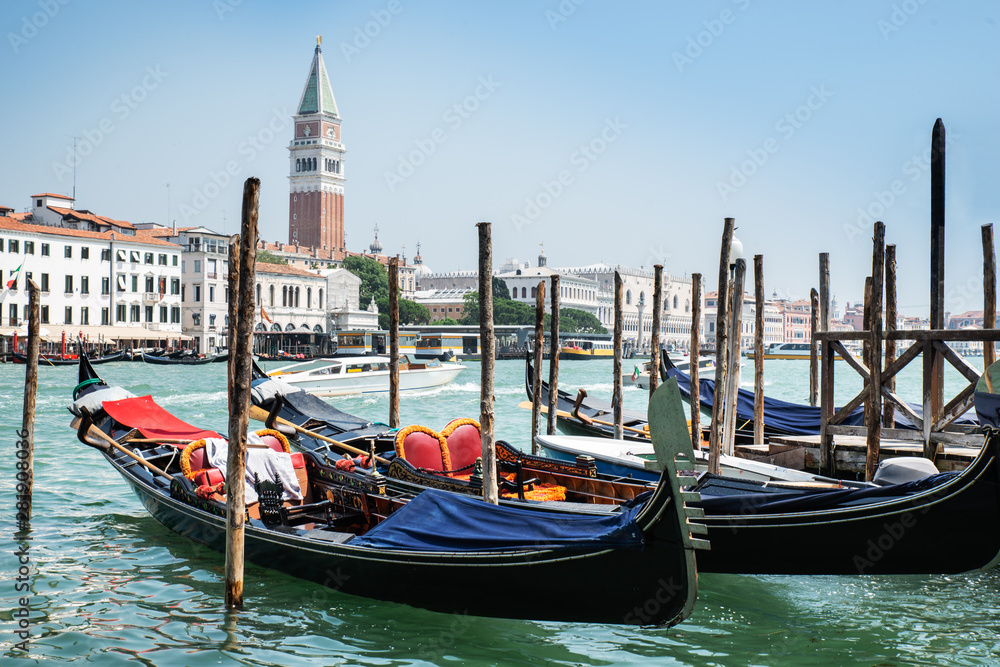 Gondolas And Bell Tower In Venice, Italy