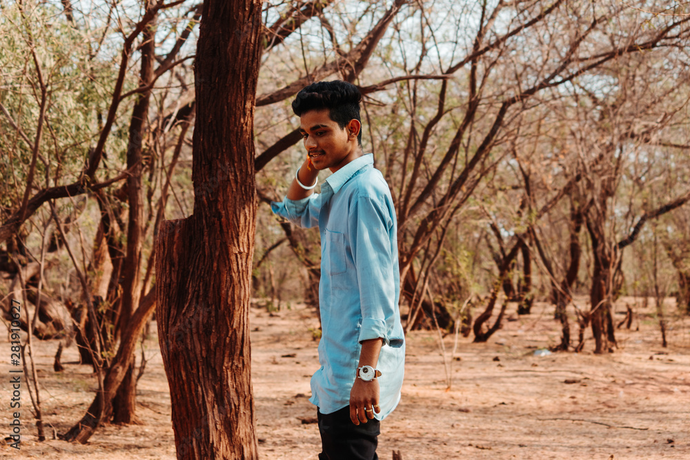 Indian male model posing in the forest