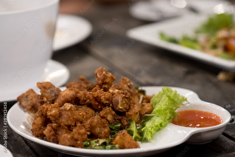 Deep fried chicken tendons with chili sauce Deep fried chicken tendons with chili sauce