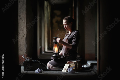 A girl with old books in the old house