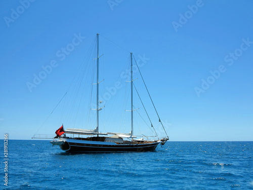 Sailing ship luxury brown wooden yacht in blue sea