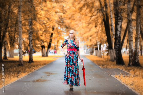 Girl in the street with an umbrella