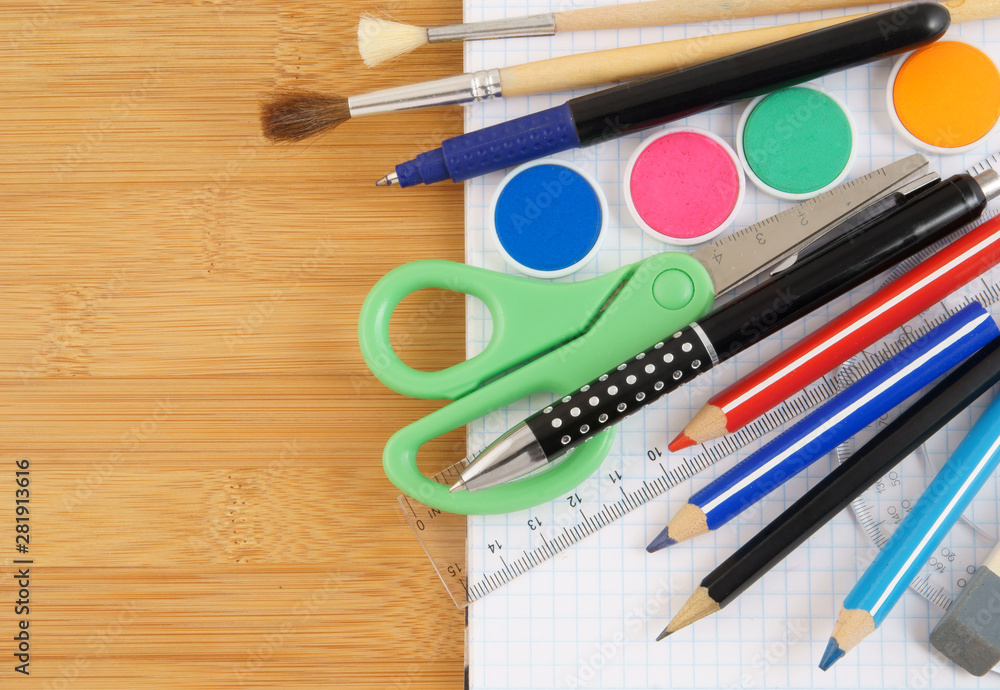 Fototapeta premium School supplies on notepad, education concept
