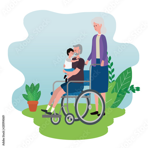 cute grandparents couple with grandson in wheelchair