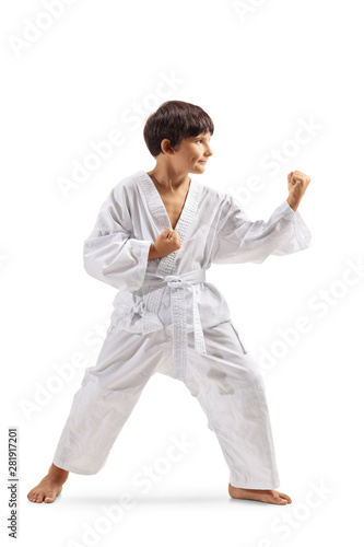 Boy in kimono practicing martial arts