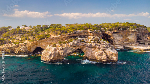 Rocky Arch in the sea, view from sea. Popular tourist destinations. Amazing natural wonder. Mirador Es Pontas, Samtanyi, Mallorca, Balearic Islands