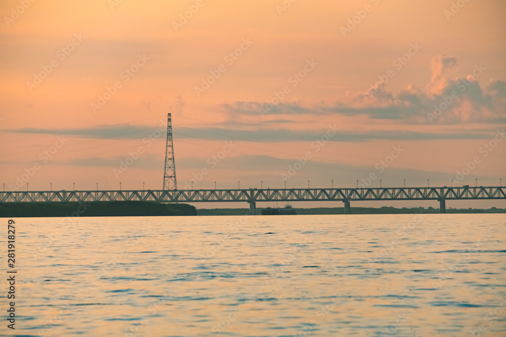 View of the Amur bridge in Khabarovsk during sunset. Russia, Far East.