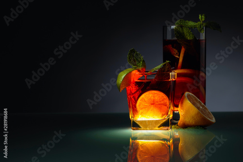 Cold tea with lime, lemon a...