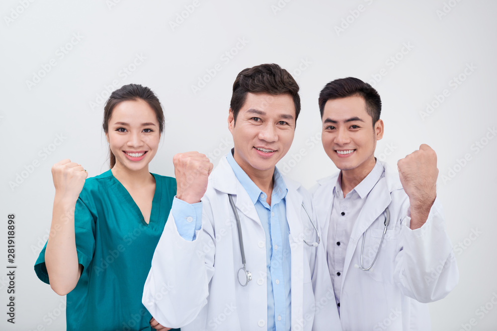 Group of young and successful doctors over the abstract background Group of young and successful doctors over the abstract background