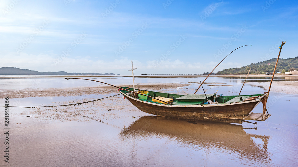 fishing boat docking on the sand bars in morning sunrise