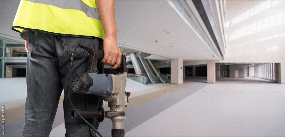 Construction Worker in front of construction site Construction Worker in front of construction site