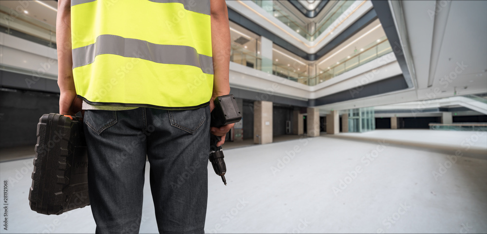 Construction Worker in front of construction site Construction Worker in front of construction site