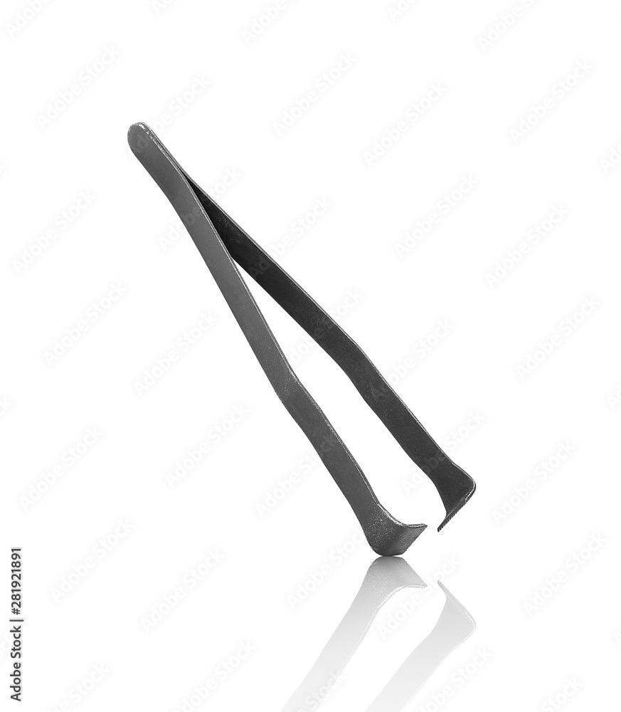 tweezers falling in the air on an isolated white background tweezers falling in the air on an isolated white background