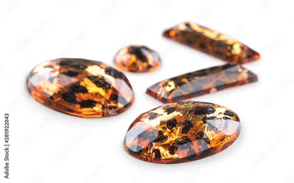 Bugle beads with leopard print closeup on isolated white background Bugle beads with leopard print closeup on isolated white background