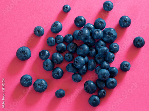 blueberry berry on a red background. summer and vitamins