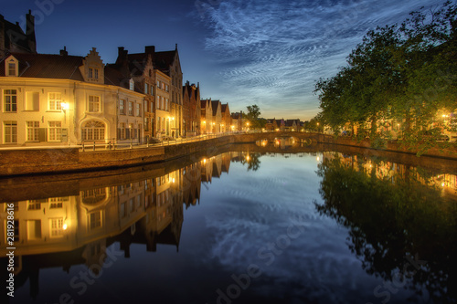 Noctilucent clouds (night shining clouds) at city Bruges (Brugge) old town in Belgium in the dusk, Europe