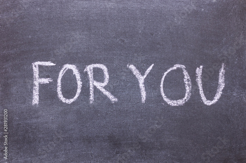 For you. Chalk lettering on blackboard. Multi colored inscription