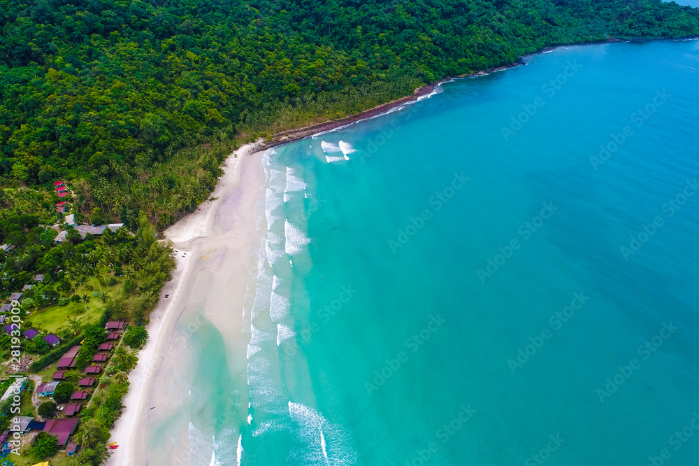 Tropical sea wave white sand beach with green tree aerial view in Koh Kood