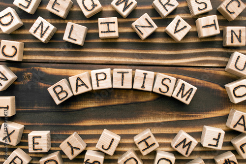 Fototapeta Baptism - word from wooden blocks with letters, Christian ceremony concept, rand
