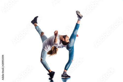 Two people stretching legs on isolated white background