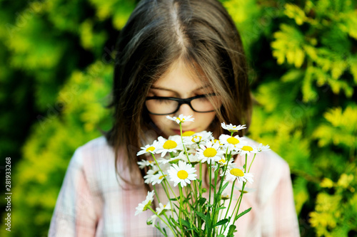 Portrait teenage with bouquet of daisies